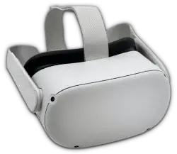 A white and black vr headset is sitting on top of a table.
